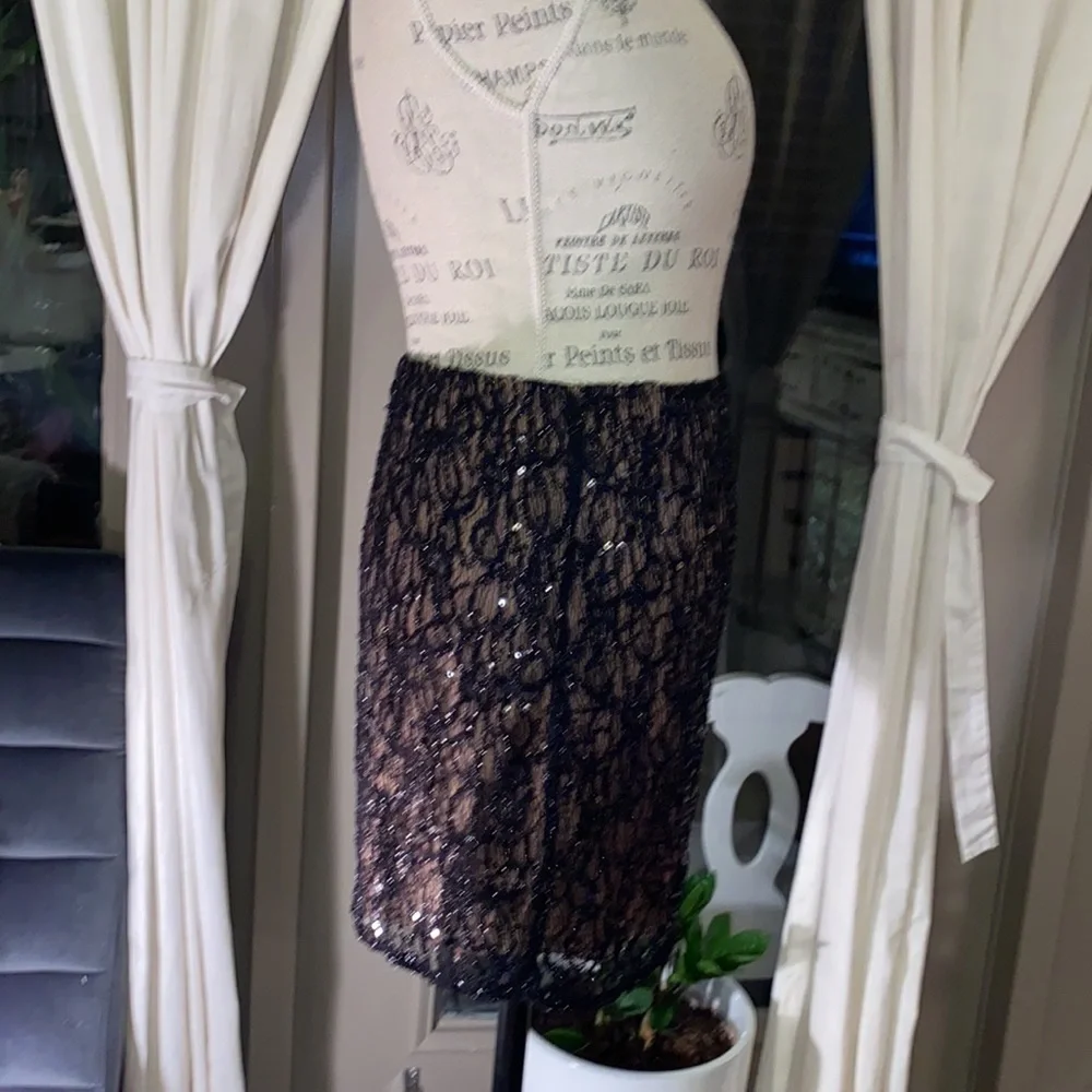 Criss Cross black lace skirt with tan lining classy dressy cocktail size Small​